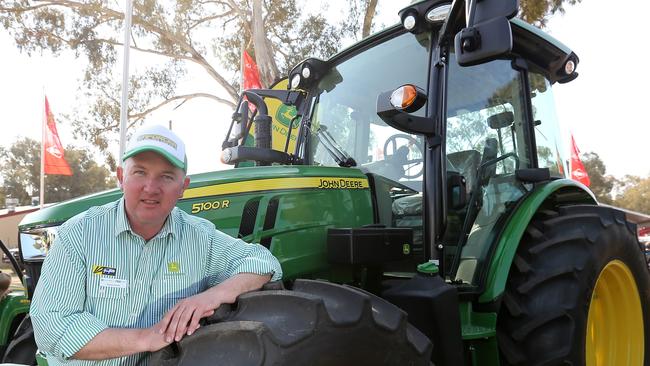 Henty Machinery Field Days, Andrew Sands,  Group Sales Manager , Griffith, with new John Deere 5100R  tractor,    picture Yuri Kouzmin