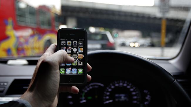 Shocking new data has revealed almost 2000 drivers were busted on North Queensland roads using their phones, and police aren’t copping it Pic. Brad Hunter