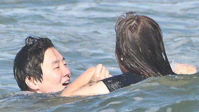 The tourists were lucky that the Queensland Surf Life Saving Championships were happening nearby when they ran into trouble.