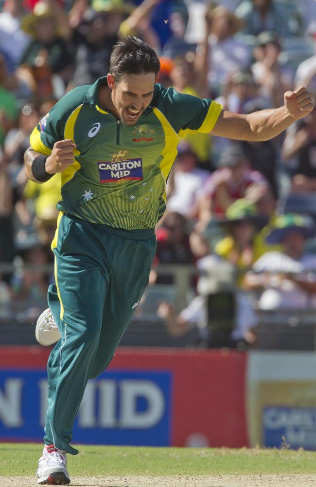 Mitchell Johnson wheels away in celebration after dismissing James Taylor.