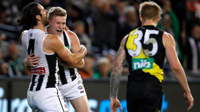 Brodie Grundy and Jordan De Goey celebrate a goal.