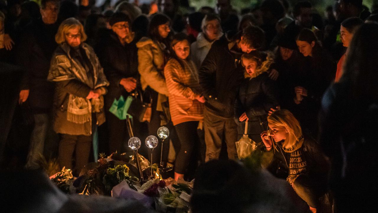 Crowds gather around the makeshift memorial. Picture: Jason Edwards