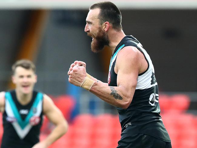 Charlie Dixon of the Power celebrates a goal during the win against West Coast.