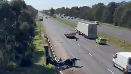 Parts of the truck spilt onto the Princes Freeway near Werribee after it crashed into a bridge. Picture: 9News