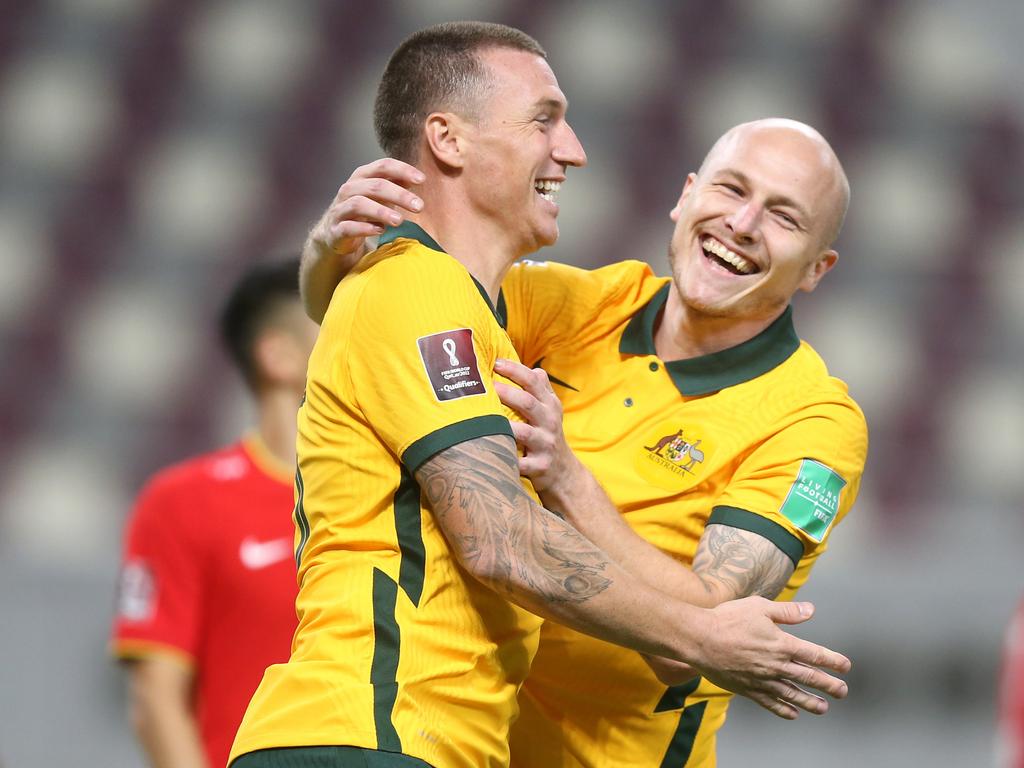 Mitch Duke (left) celebrates with Aaron Mooy after scoring against China in September. Picture: Mohamed Farag / Getty Images