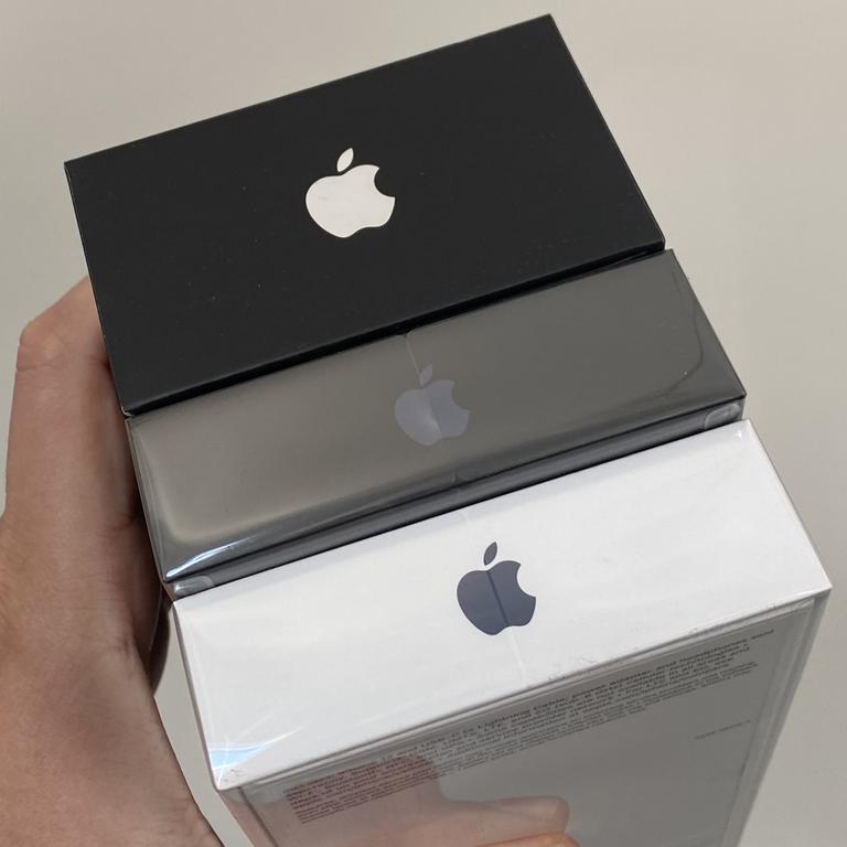 A box for the iPhone 11 Pro (top, black) is roughly the size of the iPhone 12 Pro and iPhone 12 boxes put together. The iPhone 11 Pro is the only iPhone to include a USB-C power plug of the kind you need for the new cables and was released only a year before Apple removed the plug from the box.