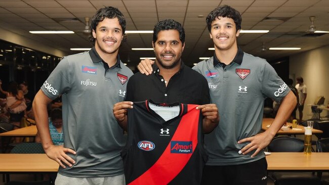 Jayden Davey with dad Alwyn Davey Sr and Alwyn Davey Jr after the twins were selected by Essendon in the 2022 draft. Picture: Essendon Football Club