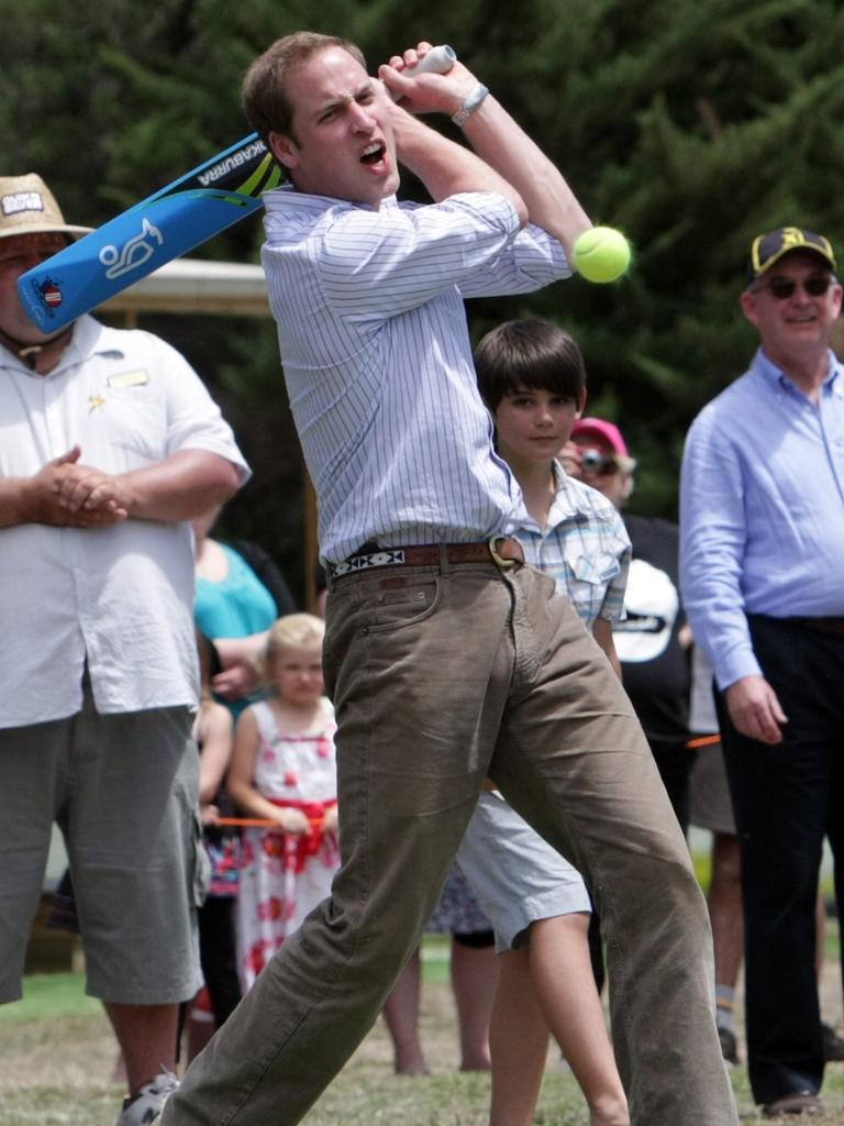 Prince Williams has a hit of cricket after lunch during a visit to the fire-affected regions of the 2009 Black Saturday fires in Victoria.