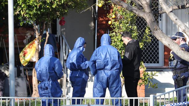 Forensic police at Uren Place, Merrylands today. Picture: John Grainger