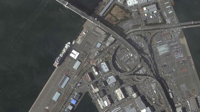 An image from the Maxar WorldView-2 satellite shows the quarantined Diamond Princess cruise ship, centre left, at Daikoku Pier Cruise Terminal in Yokohama. Picture via AFP