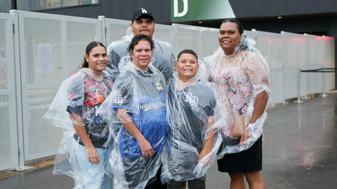 The Smith family had their ponchos ready to go on a wet night in Townsville. Picture: Blair Jackson