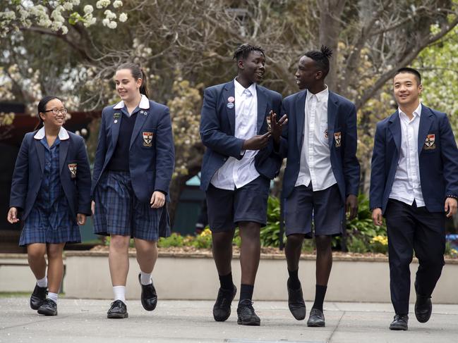 St Francis Xavier College students Cassandra, Harper, Justin, Mawien and Edward in Beaconsfield, Thursday, Oct. 10, 2019. The school received the most in government funding of any school in Victoria - but this is because it's one of the fastest growing schools in the state, with a diverse student population, in a burgoening growth area.Picture: Andy Brownbill