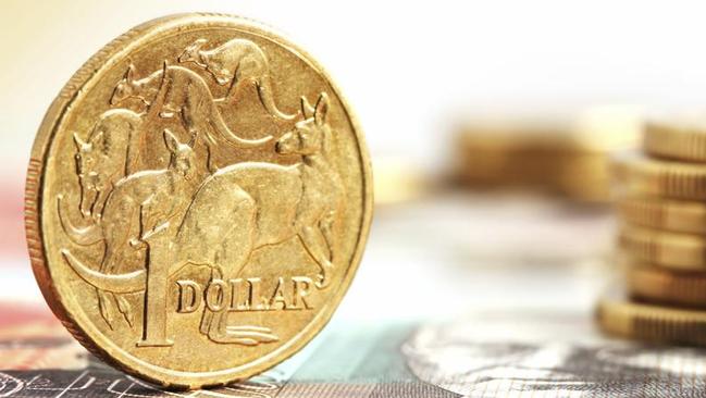 Aussie one dollar coins, on a twenty dollar note.