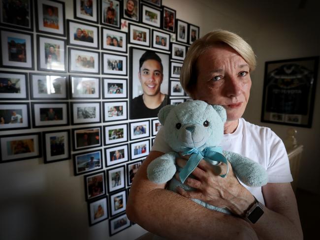 Julie Tam with a blue teddy bear she found that reminded her of one son Joshua had as a toddler. Picture: Jamie Hanson