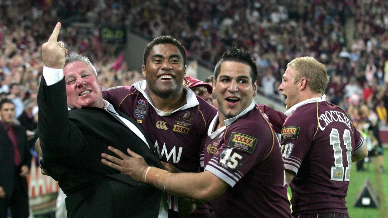 Qld manager Chris Close gives a rude finger sign with Maroons players Petero Civoniceva and Carl Webb looking on. Pic: Michael/Ross.