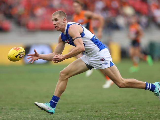 Dylan Stephens should teach North Melbourne a thing or two about tackling. Picture: Jason McCawley/AFL Photos/via Getty Images.