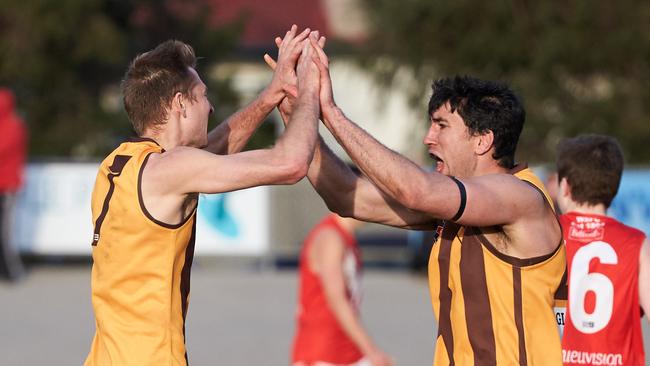 Key West Croydon player Luke Woodcock (left) celebrates one of his many goals. Picture: Matt Loxton