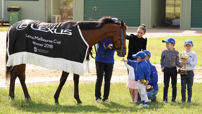 Melbourne Cup-winning jockey Kerrin McEvoy (centre right), his wife Cathy (centre) and his children Eva, Rhys, Jake and Charlie spend time with winner Cross Counter in 2018. Picture: AAP