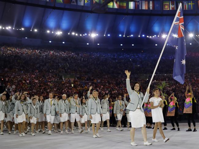 Anna Meares carries the flag of Australia during the opening ceremony.