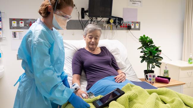 SIM lab manager Alison McDonald simulates a test of the device with local GP and Clinical Dean Dr Susan Paul.