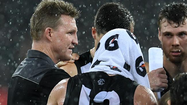 Nathan Buckley talks to his players during the club’s win over Gold Coast. Picture: AAP Images