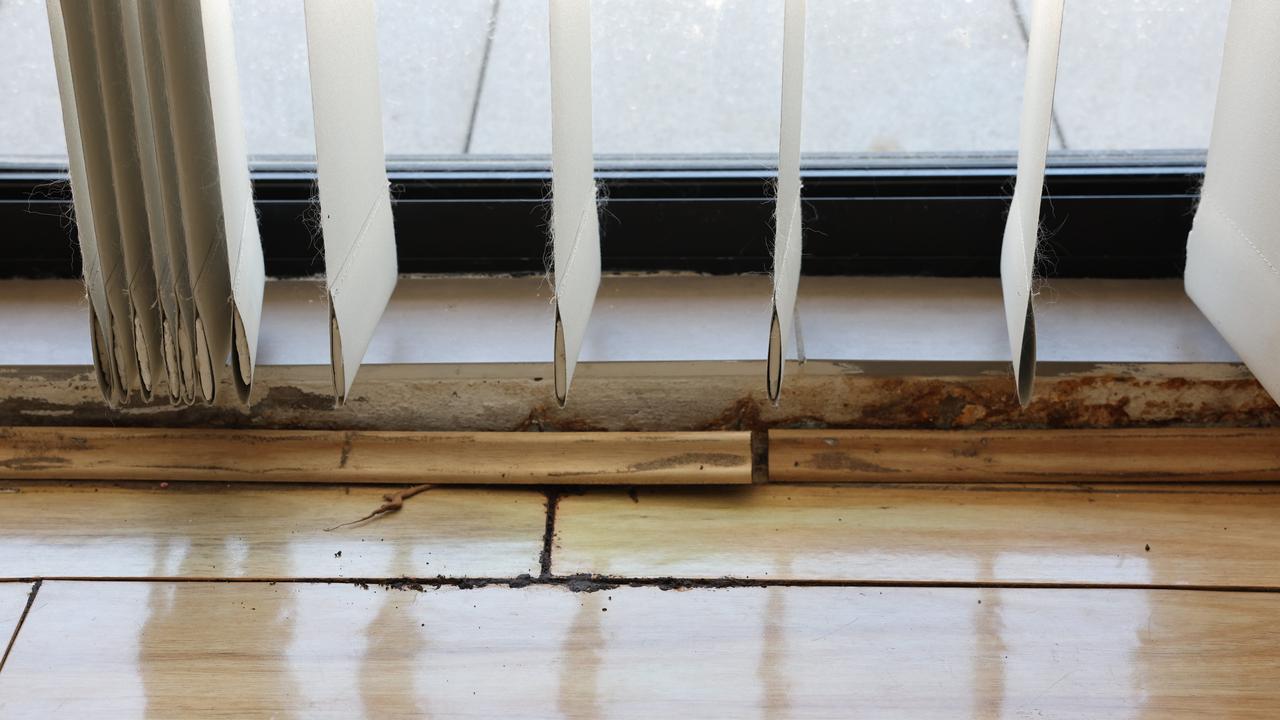 Renters that requested a sealing issue that was causing water damage to their floorboards be fixed allege they were handed an eviction notice for requesting repairs. Picture: Tim Hunter.