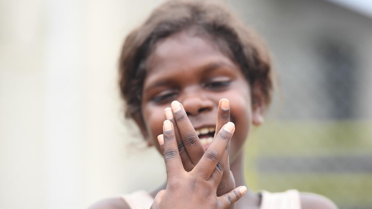 Rockhole residents take their first steps outside after a week long hard lockdown. Picture: Amanda Parkinson