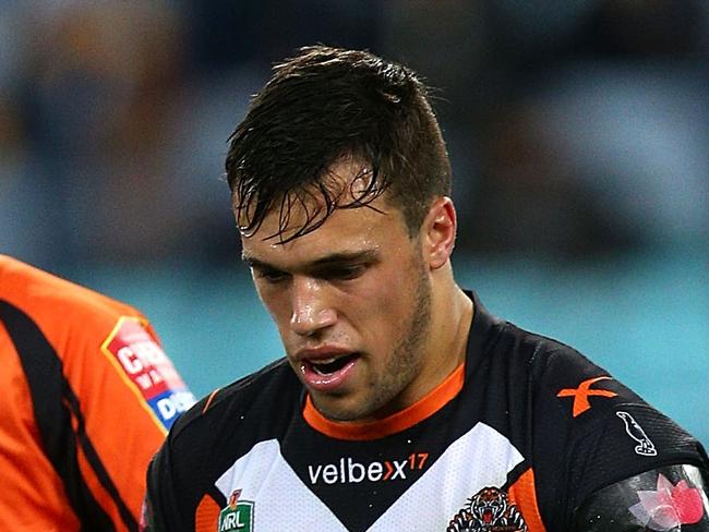 SYDNEY, AUSTRALIA - AUGUST 21: Luke Brooks of the Tigers leaves the field injured during the round 24 NRL match between the Canterbury Bulldogs and the Wests Tigers at ANZ Stadium on August 21, 2014 in Sydney, Australia. (Photo by Renee McKay/Getty Images)