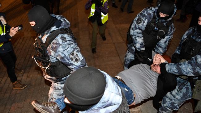 Riot police officers detain a man during a protest against Russia's invasion of Ukraine in central Moscow on March 2. Picture: AFP