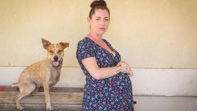 Palmerston mum-to-be Laura Rees and her faithful dog Piper after her new car was stolen and used in a ram raid. Picture Glenn Campbell