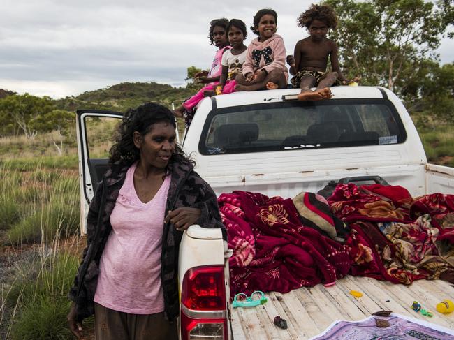 Serena Morton Nabanunga, an Alyawarre woman, her daughter Nina and relatives on the land where the first three homes of the Wilya Janta (Standing Strong) Housing Collaboration project will be built. Picture: Andrew Quilty/Climate Council