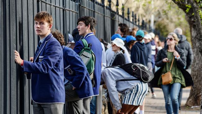 Covid restrictions meant only 1,000 people were allowed inside the ground, forcing supporters and students to resort to other means of watching the big game. Pictures: Brenton Edwards