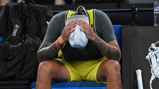 Australia's Nick Kyrgios puts his head in his hands as he reacts with an injury during his men's singles match against Britain's Jacob Fearnley on day two of the Australian Open tennis tournament in Melbourne on January 13, 2025. (Photo by WILLIAM WEST / AFP) / -- IMAGE RESTRICTED TO EDITORIAL USE - STRICTLY NO COMMERCIAL USE --