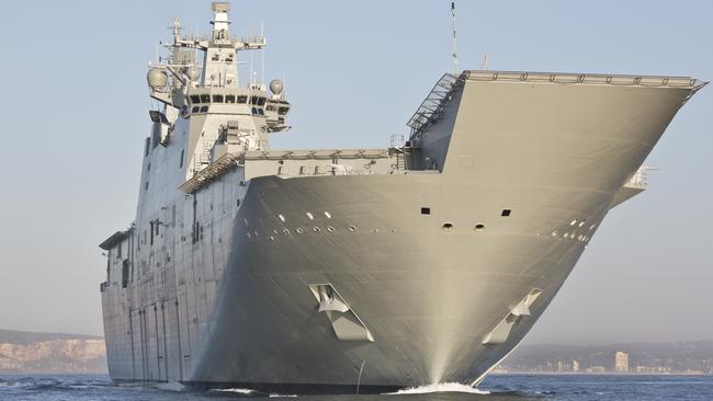 NUSHIP Canberra enters through the heads of Sydney Harbour.