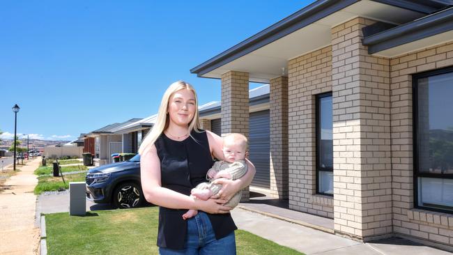 Imogen and her baby Dakota at their Munno Para home. Image/Russell Millard Photography