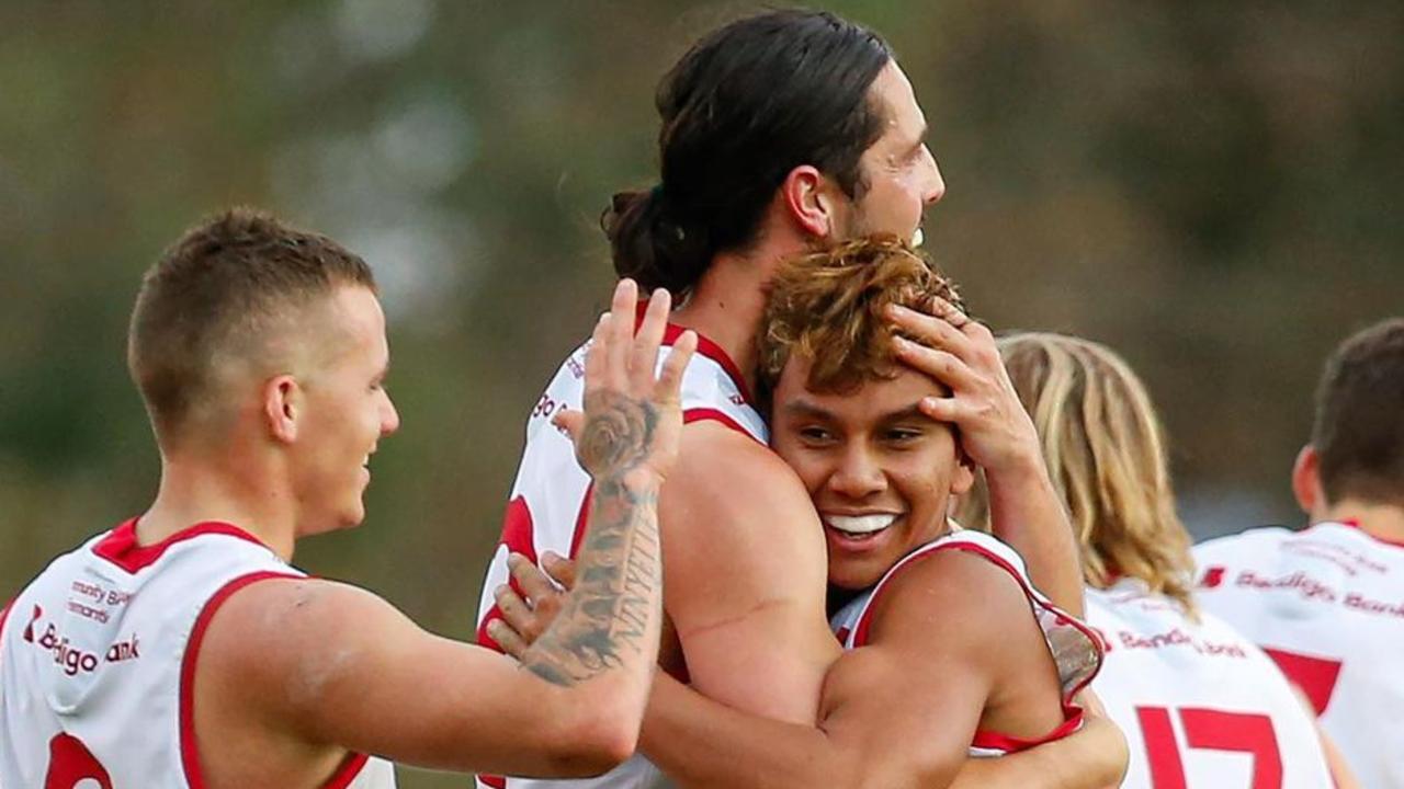 Jesse Motlop celebrates his first senior WAFL goal with teammates.