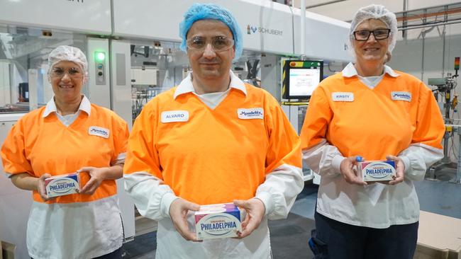Mondelez Suttontown plant manager Alvaro Camblor with factory workers Cindy Burford and Kirsty Johnson have enjoyed job security during the pandemic as sales of Philadelphia cream cheese skyrocket. Picture: Jessica Ball