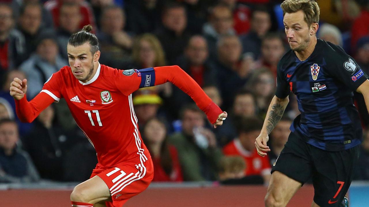 Wales' striker Gareth Bale (L) earned the Welsh a point against Luka Modric’s Croatia. (Photo by GEOFF CADDICK / AFP)