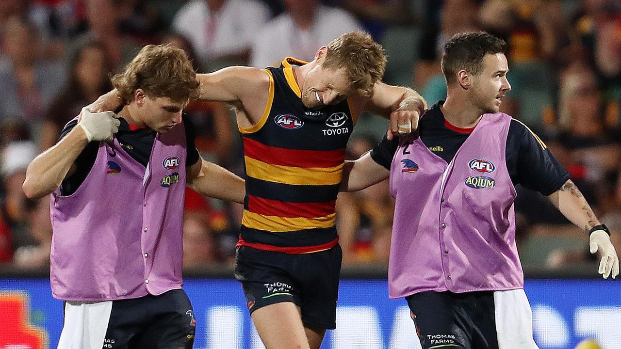 Sloane was in visible pain as he left the field injured. Picture: Sarah Reed/AFL Photos via Getty Images