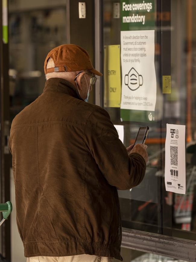 A customer scans a QR code before entering a supermarket in Doncaster, Melbourne. Picture: NCA NewsWire / Daniel Pockett