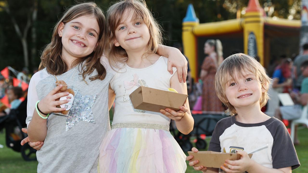 Ruby Kidd, 7, Tilly Byrne, 8, and Rowan Byrne, 4, at the Barron River Food Festival, held at the Stratford Dolphins Football Club. Picture: Brendan Radke