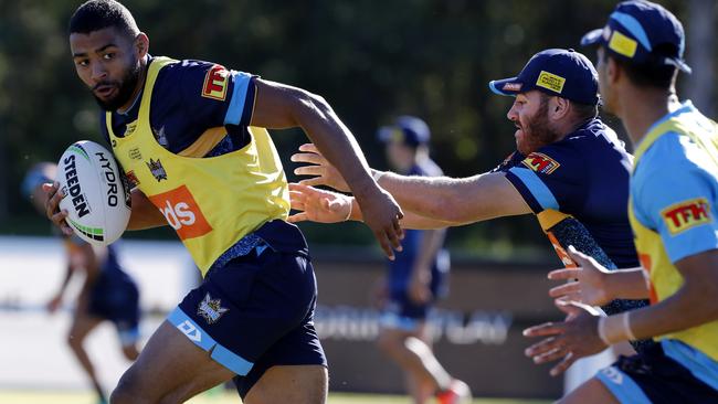 Kallum Watkins tries to escape the clutches of Brenko Lee at training. Picture: AAP Image/Regi Varghese