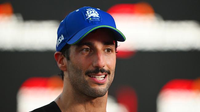 SINGAPORE, SINGAPORE - SEPTEMBER 22: 18th placed Daniel Ricciardo of Australia and Visa Cash App RB speaks to the media after the F1 Grand Prix of Singapore at Marina Bay Street Circuit on September 22, 2024 in Singapore, Singapore. (Photo by Rudy Carezzevoli/Getty Images)