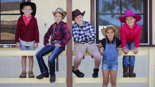 Wyee Public School students Cody Kirk, 8, Ellie Snell, 12, Harry Stockade, 10, Haileigh Robb, 7, and Breanna Antees, 9, dressed in farm clothes for their mufti day to raise money for the farmers. Picture: Liam Driver