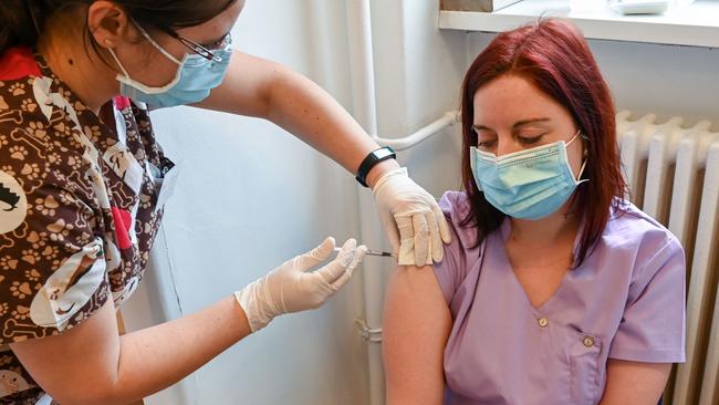 A nurse receives her second dose of the Pfizer-BioNTech coronavirus vaccine at a medical centre in Budapest, Hungary. Picture: AFP