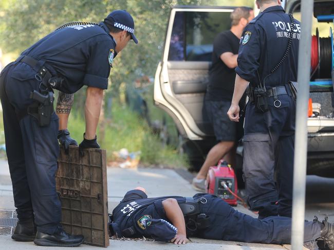 Police search for evidence at the scene of Prabha Kumar’s murder. Picture: John Grainger