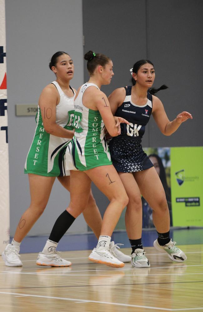 QISSN 2024 division 1 grand final: Canterbury v Somerset. Pictured: GS Roxy Rhind, GA Marley Burns (White) and GK Kaitlyn Iva (Blue)