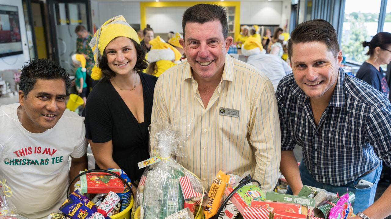 Volunteers Alex Shah and Araminata Pearce, with YellowBridge CEO Adrian Bonica and Toowoomba Councillor Tim McMahon at the YellowBridge hamper packing day. The charity has put together 300 yellow buckets for those in need across the region this Christmas. December 17, 2024. Picture: Christine Schindler