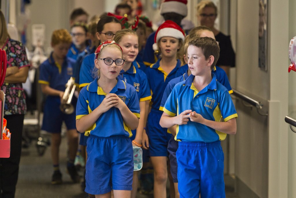 Leading the group are Lila Sullivan and Oscar Ghidella as Mater Dei Primary School Yr 4 students sing Christmas carols in the wards of St Vincent's Private Hospital, Friday, November 29, 2019. Picture: Kevin Farmer