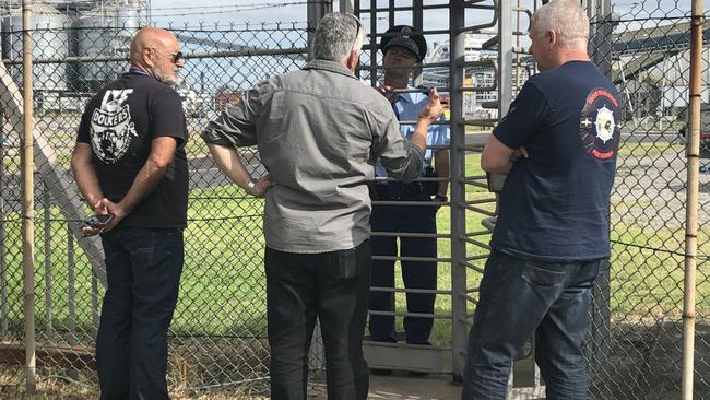 Union delegates try to gain access to the Port Kembla grain terminal where the Ruby Princess is docked. Picture: Madeline Crittenden. 